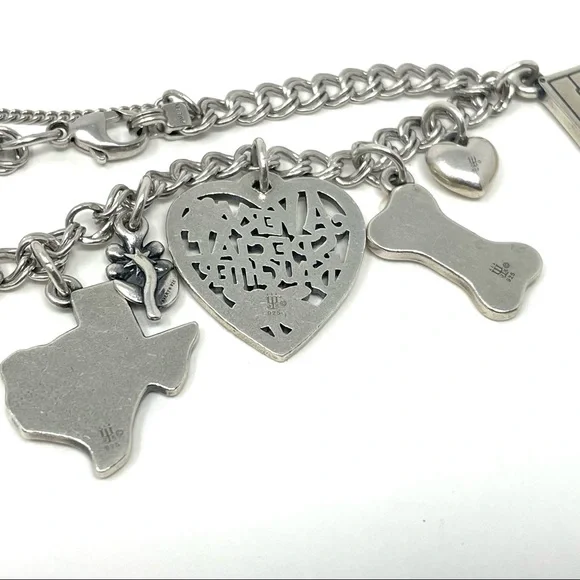 JAMES AVERY sterling silver charm bracelet, 8 charms Bracelets
